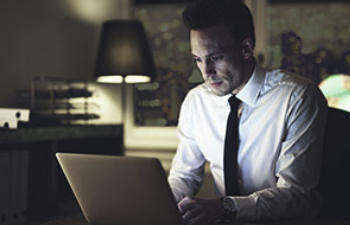 a man is working on a laptop