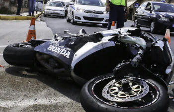 the motorcycle is lying on the street after the accident